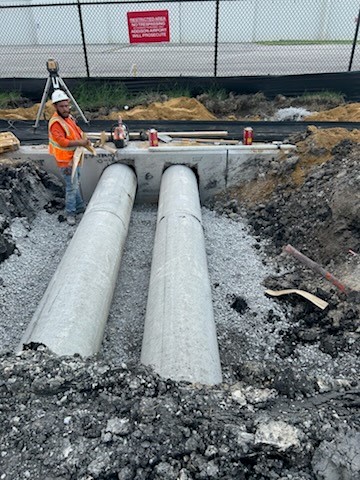 Stormwater Reinforced Concrete Pipe (RCP) being installed and backfilled on Jimmy Doolittle.